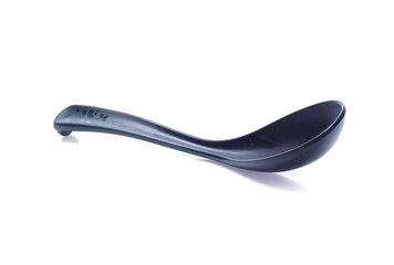 plastic black spoon, isolated on white background