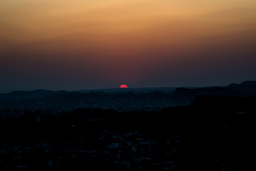 Obraz premium Sunset at Jodhpur city aerial view from top of Mehrangarh or Mehran Fort 