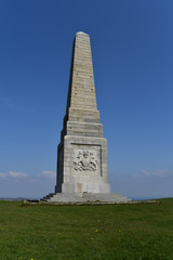 An obelisk in the summer sunshine on a hilltop in the Isle of Wight