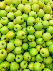 lots of ripe green sweet apples for eating like the background