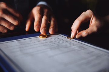 Merriage divorce process. Separation of spouses in the lawyer's cabinet. People sign agreement