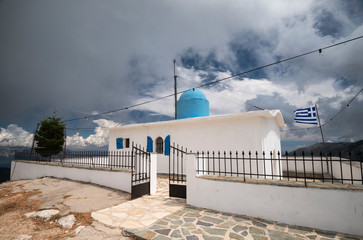 Prophet Elias Holy Temple, an orthodox church is standing up the hill in a greek landscape