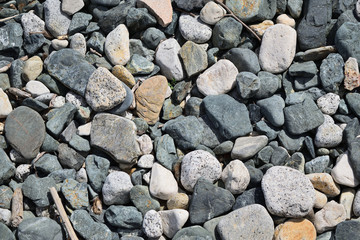 Pebbles on the beach in Samothraki island, Greece, Aegean sea. Sea rocks. Background, Texture