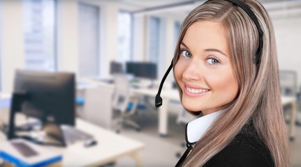 Happy young woman face with headphones, call center or support concept