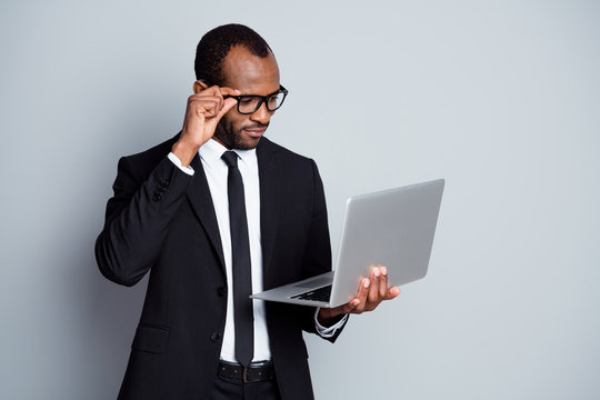 Portrait of smart focused afro american chief executive lawyer use laptop read colleagues presentation wear tux blazer jacket isolated over gray color background