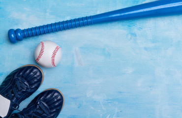 Baseball equipment on blue wooden background. Online workout concept.