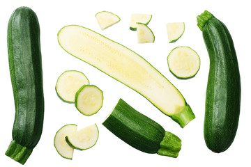 fresh green zucchini with slices isolated on white background. top view