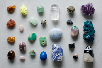 Beautiful bright multi-colored collection of natural stones and minerals from around world lies on...