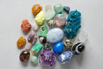 Beautiful bright multi-colored collection of natural stones and minerals from around world lies on...