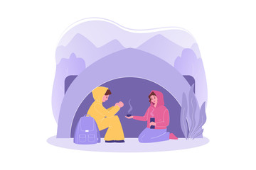 Travelling couple, hiking, tourism, camping concept. Couple in love man woman boyfriend girlfriend travelers hikers hide in camp from cold drink tea. Vacation trip with active lifestyle and recreation