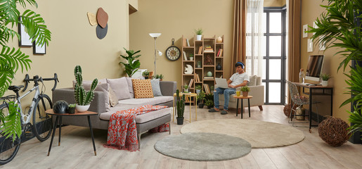 Man at home and corona virus warning interior decoration.