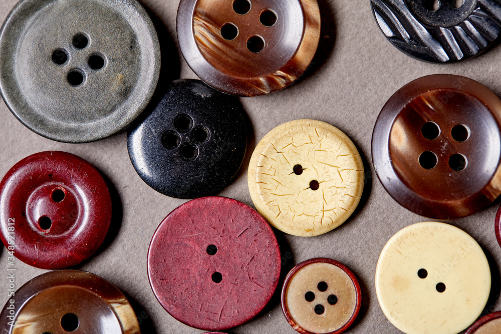 Poster Background and texture of multicolored antique buttons