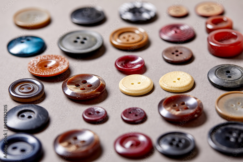 Poster Background and texture of multicolored antique buttons