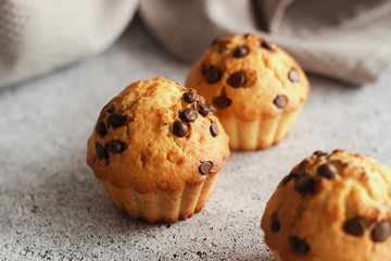 Delicious orange muffins with chocolate. Muffins on the table