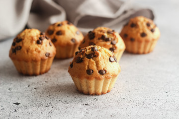 Delicious orange muffins with chocolate. Muffins on the table