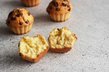 Delicious orange muffins with chocolate. Muffins on the table