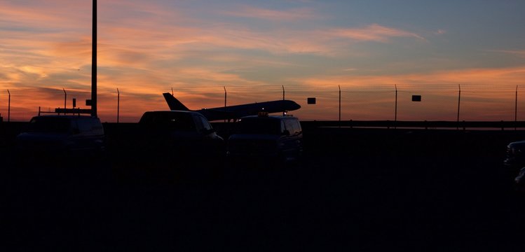 Side View Of Silhouette Airplane Taking Off