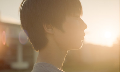 Close up of boy standing outdoors