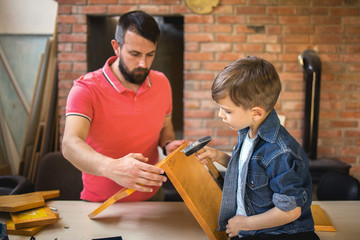 Father and Son Making a Birdhouse