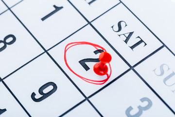 2020 calendar page marked with an important date in red pin. timeline, time, concept, idea,...