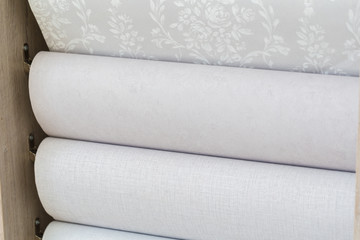 Obraz premium Trendy multicolored modern design rolls Wallpaper as background. Luxury wallpapers for interiors.