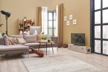 Man at home and working style. Brown living room concept, television spend time.