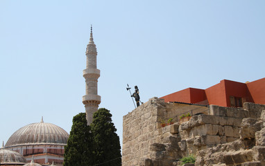 Mosque in the old city of Rhodes in Greece, roofs and a medieval knight in armor