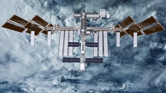 International Space Station ISS revolving over earths atmosphere. Elements of this image furnished by NASA.