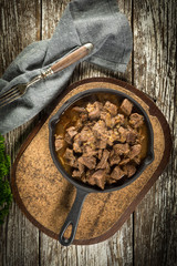 Beef stew in a cast iron skillet.