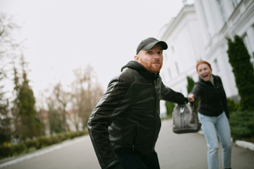 Young woman gets bag snatching on the street , Beware of  thief, robbery on the young red hair girl...
