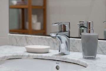 Modern white marble  bathroom, sink and soap