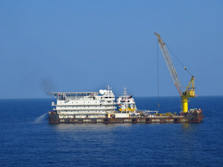 Fototapeta premium A typical Offshore Accommodation and Work Barge in the Oil and Gas industry. Offshore Accommodation Barge to serve as an offshore hotel to personnel and crew.