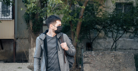 young man in a protective mask