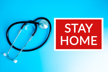 Medical, showing Stay Home sign on blue hospital banner background with Stethoscope. COVID-19 outbreak emergency workers. Coronavirus board panoramic corona virus text title.