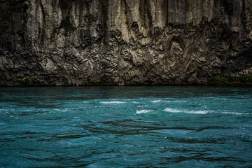 rock formation over deep river