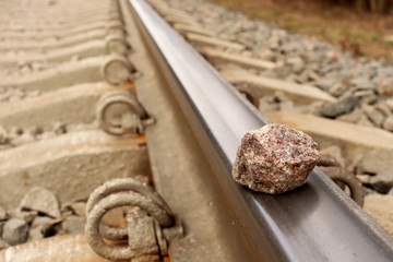 Rails. Railways. Stone on the rails. Rail transportation