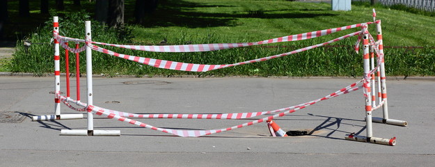 The railings of the barriers and striped tape