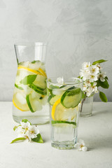 Detox drink, lemonade. Refreshing summer drink with lemon, ginger, fresh cucumber and mint. The concept of healthy and dietary nutrition.
