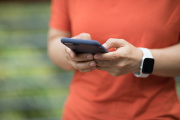 Hands using smartphone at outdoors