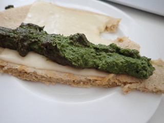 bread with slice of cheese and green pesto