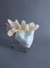 shopping cart with mask and gloves