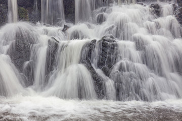 Fototapeta premium A waterfall in a forest in central Sweden photographed by a long exposure.