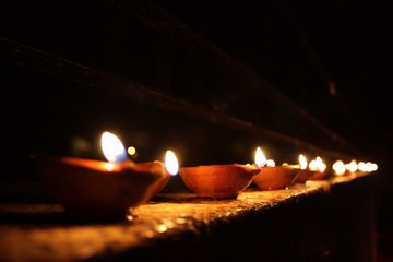 burning candle in the fireplace