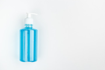 Bottle of blue antiseptic on a white background