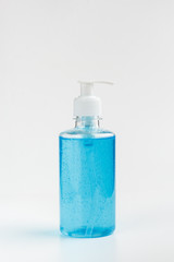 Bottle of blue antiseptic on a white background