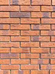 Brick wall background. Decorative brickwork from a smooth new brick. Copy space on the background...