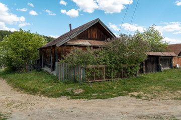 Fototapeta na wymiar A hut in a Siberian village