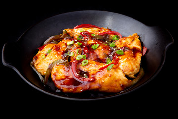 chicken teriyaki on the black plate