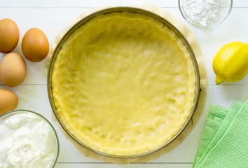 Step by step recipe of cheesecake. Shortbread dough in a baking dish