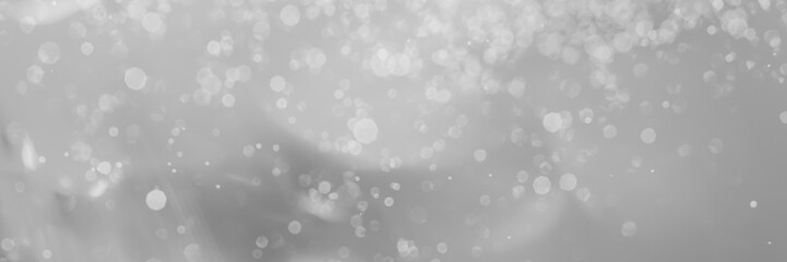 abstract gray background with bokeh lights and sunlight, panoramic background